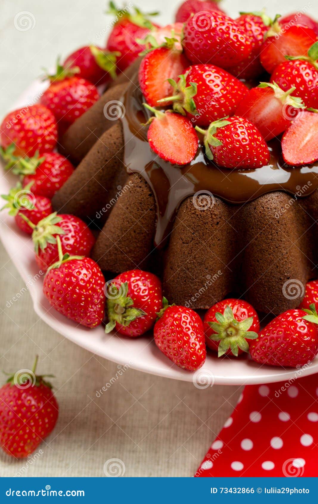 Chocolate Cake. Decorating With Chocolate Icing And Strawberries Stock