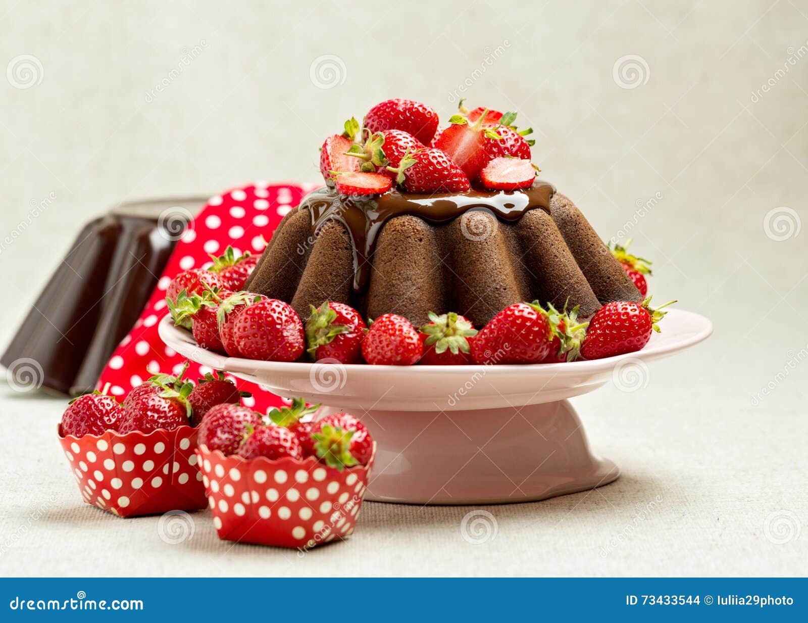Chocolate Cake. Decorating with Chocolate Icing and Strawberries Stock