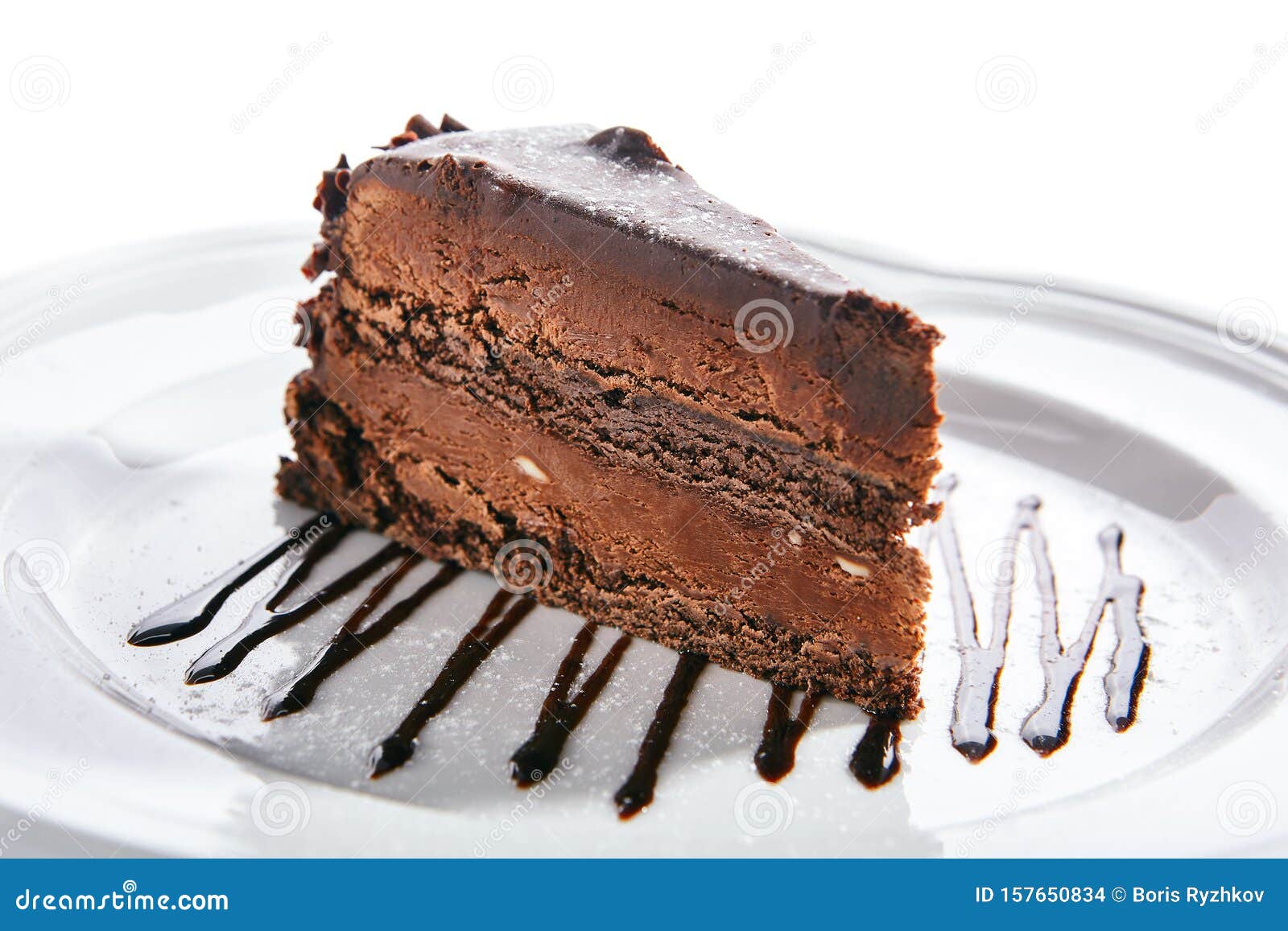 chocolate cake, triangular slice of brown biscuit tart or sachertorte