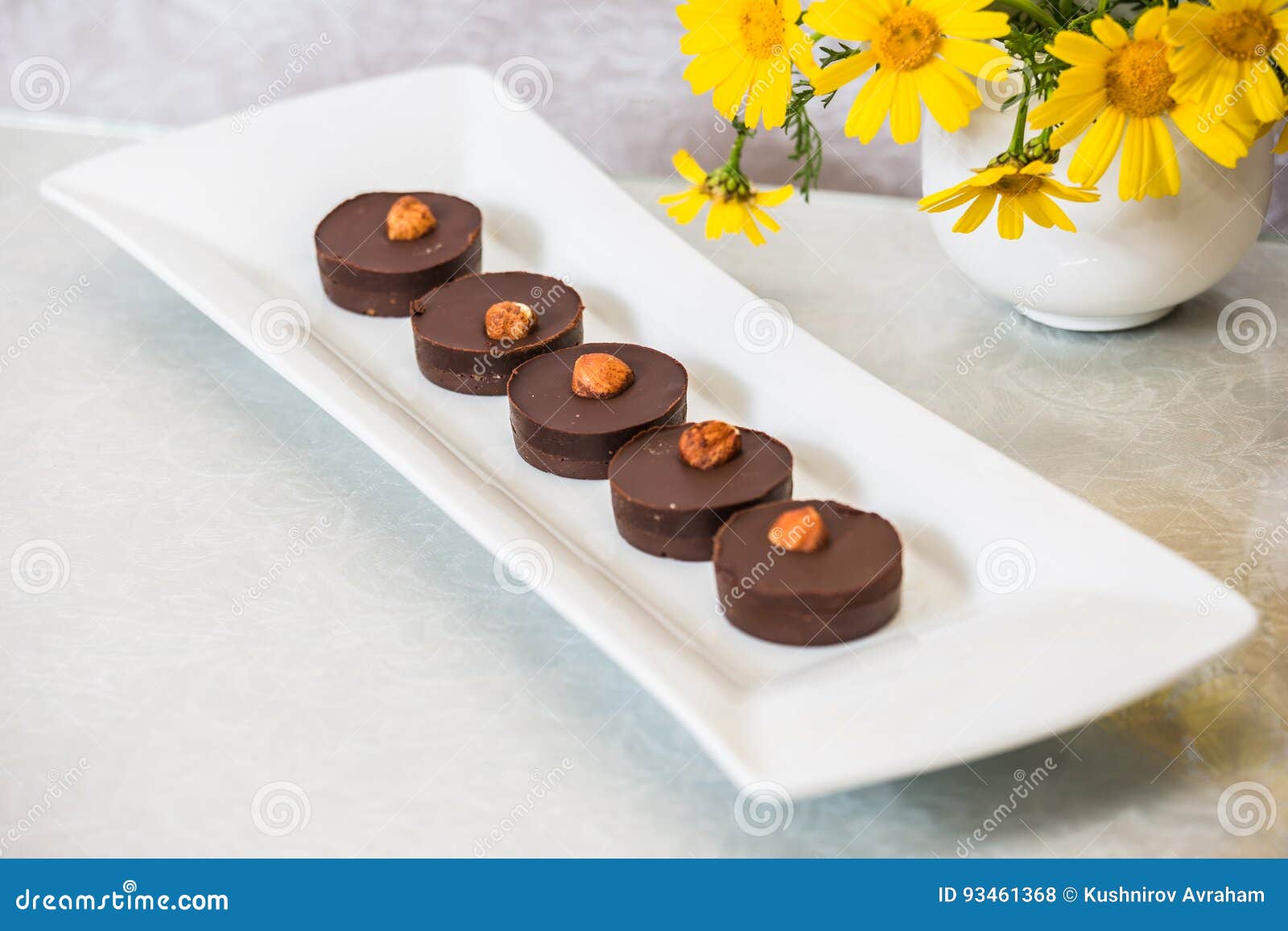 chocolate cakes are decorated with nuts