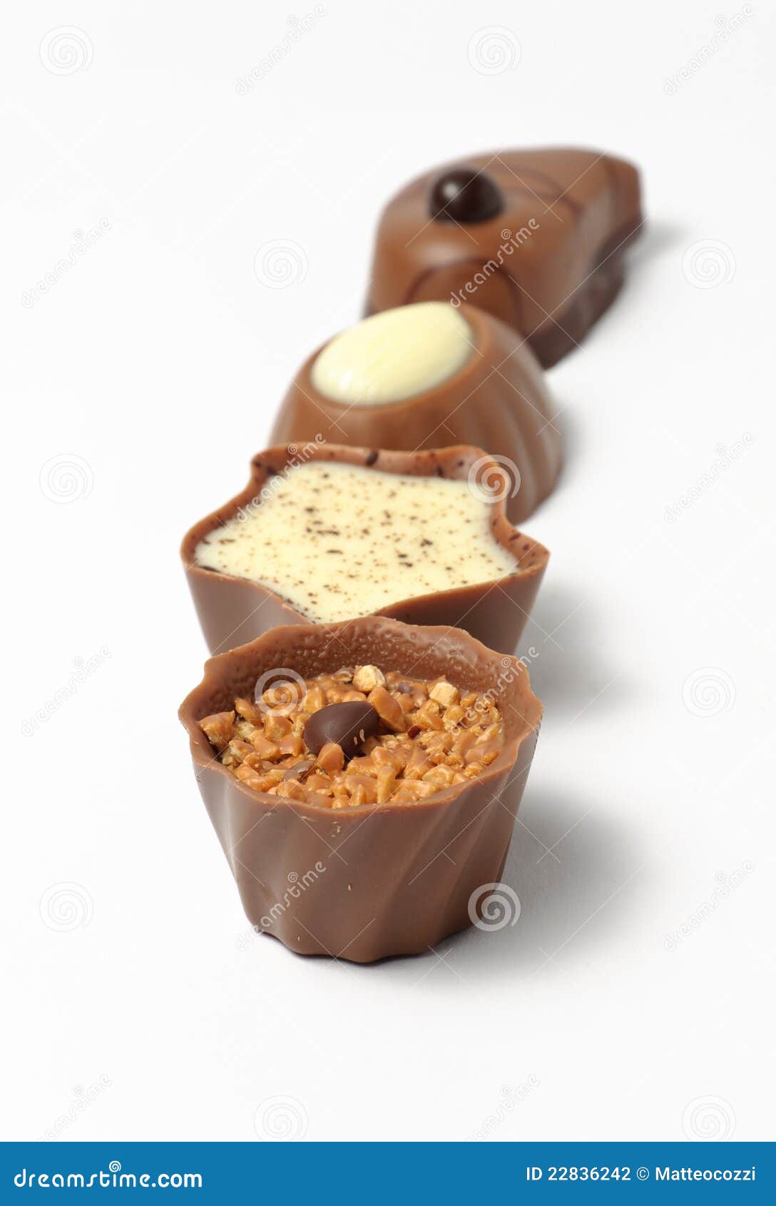 Chocolate candy in a row stock photo. Image of selection 22836242