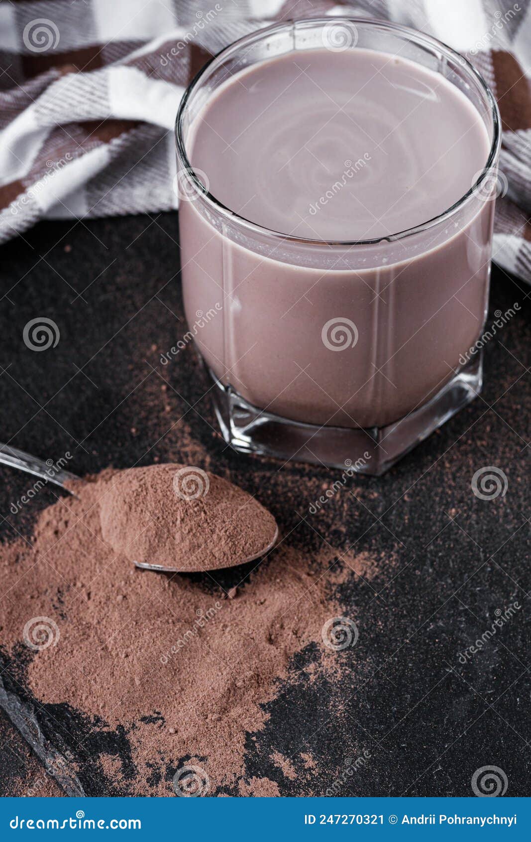Chocolate Cocoa Milk Powder on a Black Stone Background Stock Image