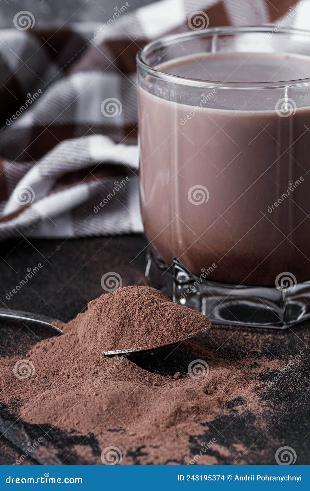 Chocolate Cocoa Milk Powder on a Black Stone Background Stock Photo