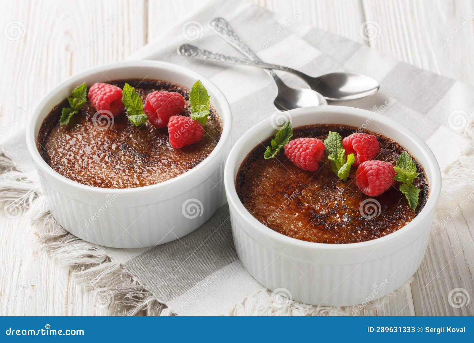 chocolate creme brulee dessert consisting of a rich custard base topped with a layer of hardened caramelized sugar close-up in a