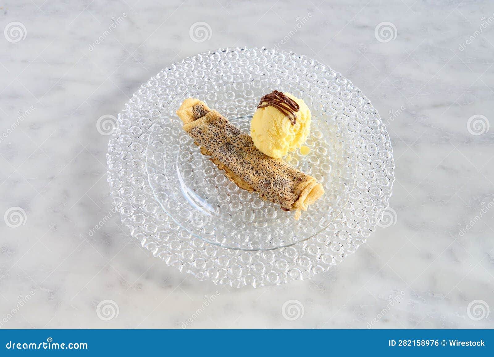 chocolate crepe with a scoop of vanilla ice cream