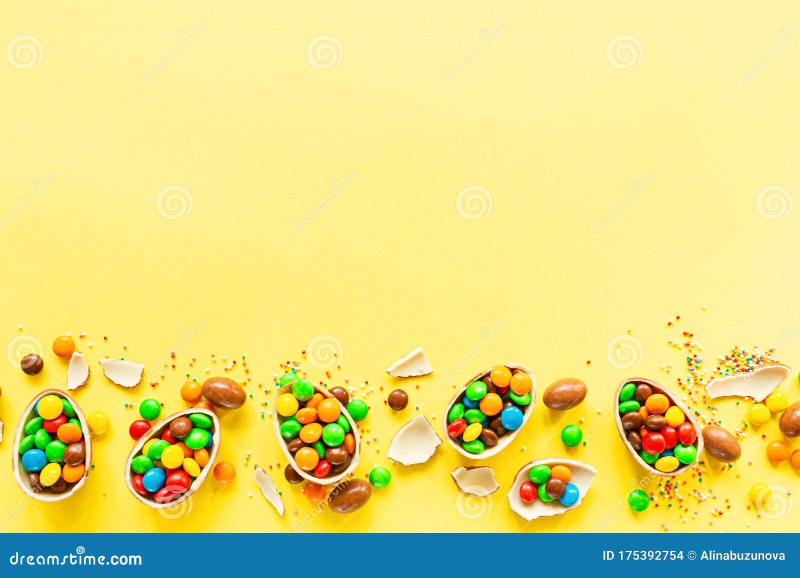 Download Chocolate Easter Eggs And Colorful Candies On Yellow Paper ...