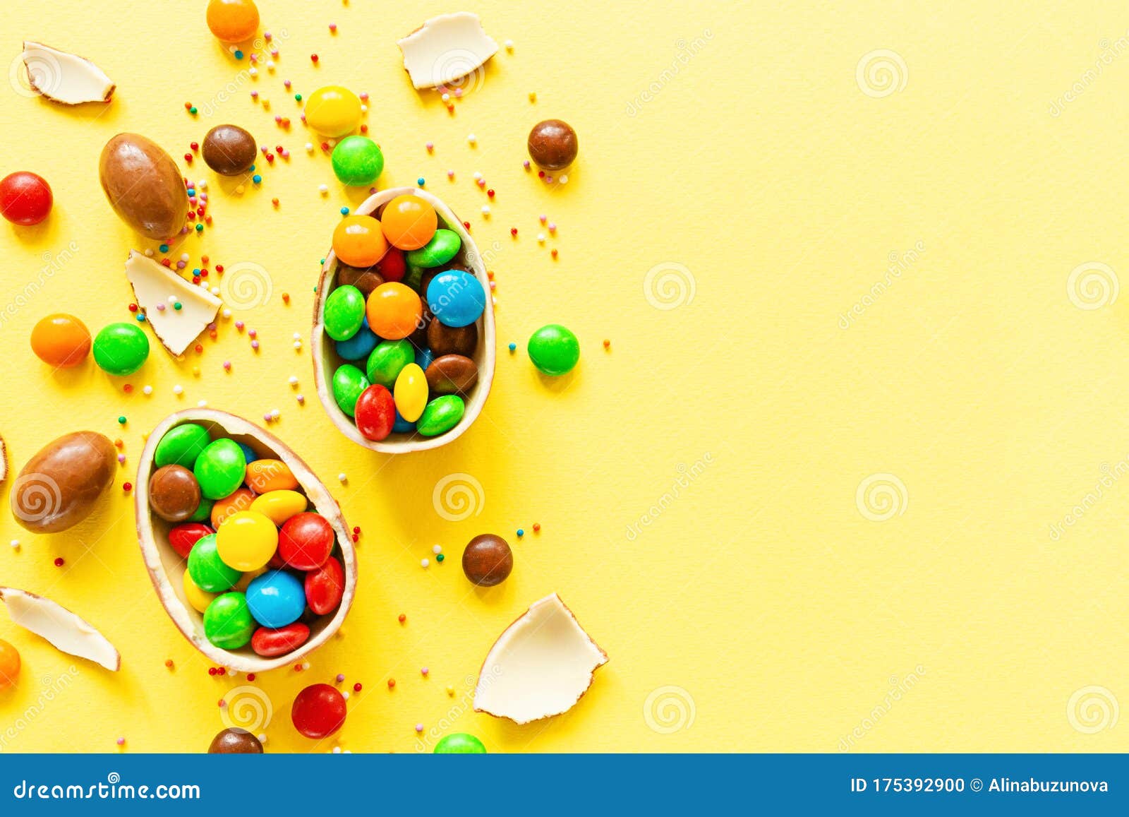 Download Chocolate Easter Eggs And Colorful Candies On Yellow Paper Background. Flat Lay, Copy Space, Top ...