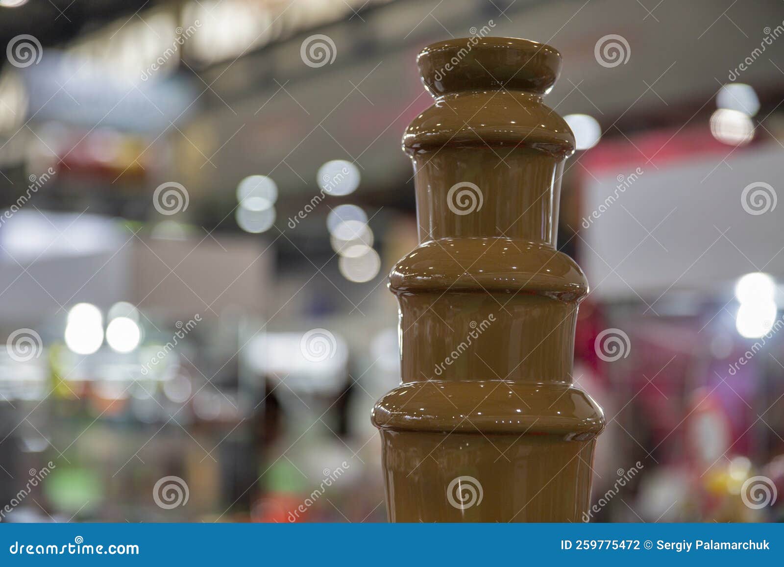 Chocolate Fountain Hot Liquid Flowing Down Tower Pyramid Stock Photo