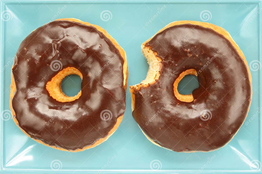 Chocolate Frosted Raised Donuts Stock Image Image of decadent, junk 4331923