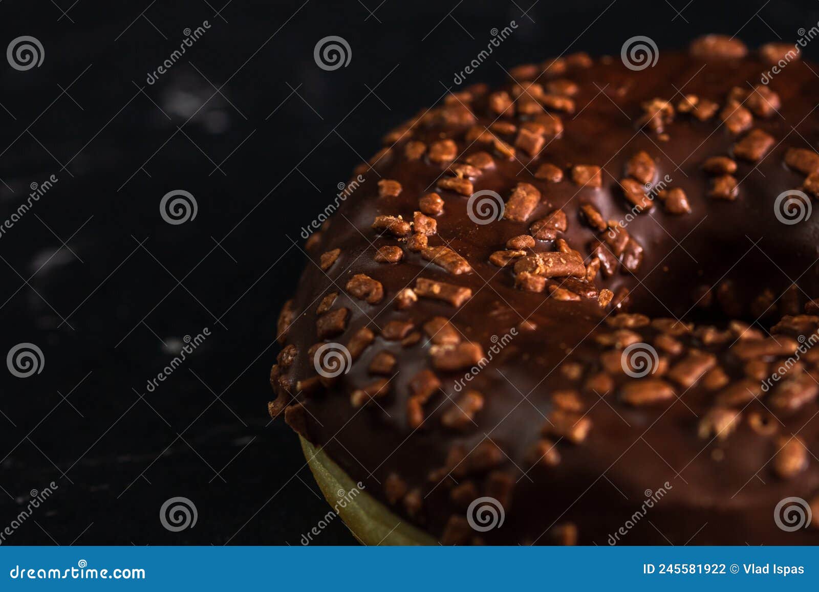 Chocolate Glazed Donut with Chocolate Chips Isolated. Close Up of