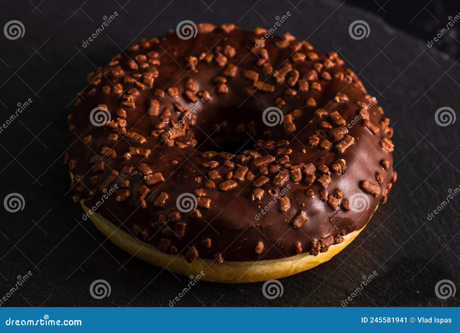 Chocolate Glazed Donut with Chocolate Chips Isolated. Close Up of