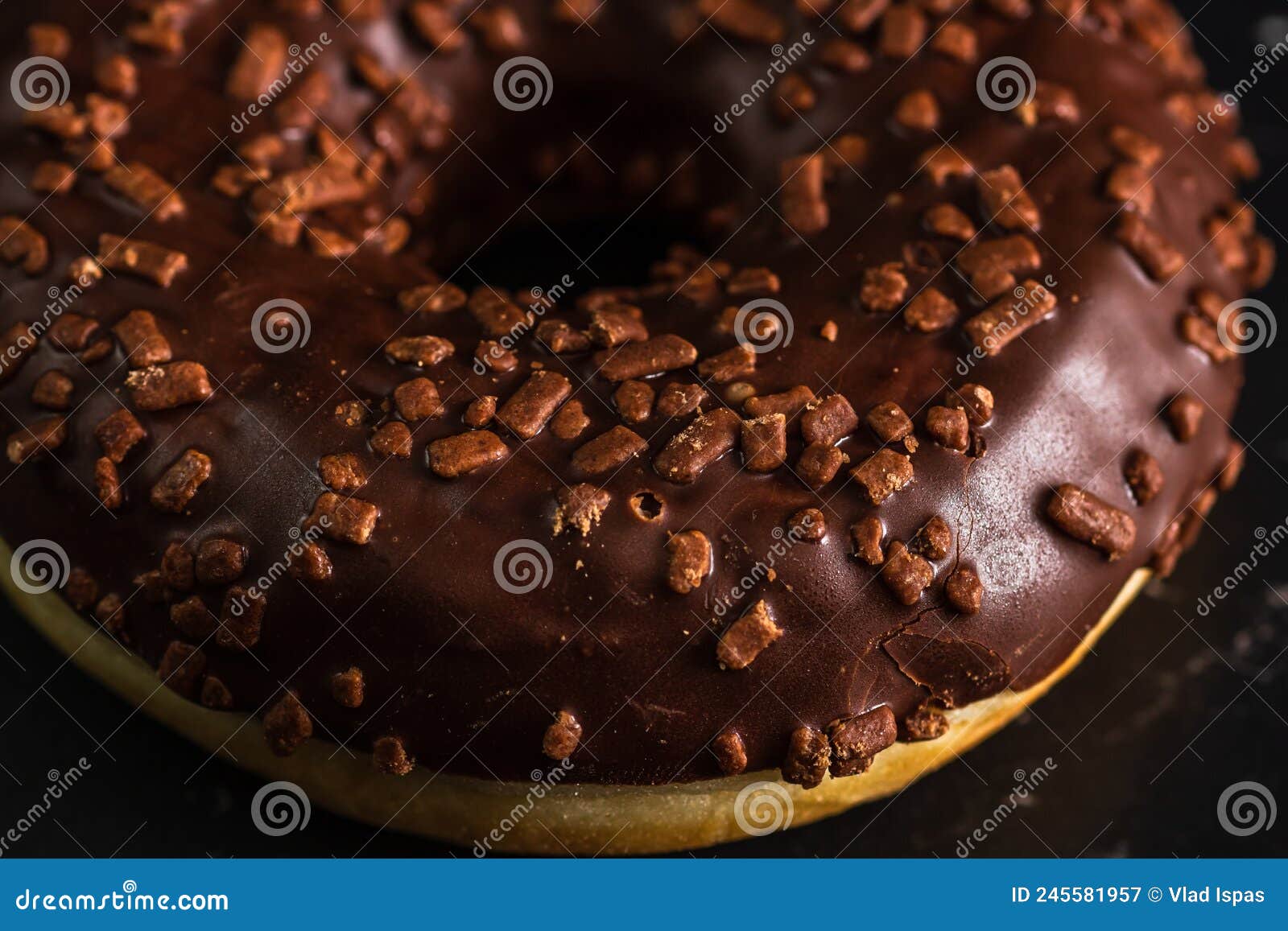 Chocolate Glazed Donut with Chocolate Chips Isolated. Close Up of