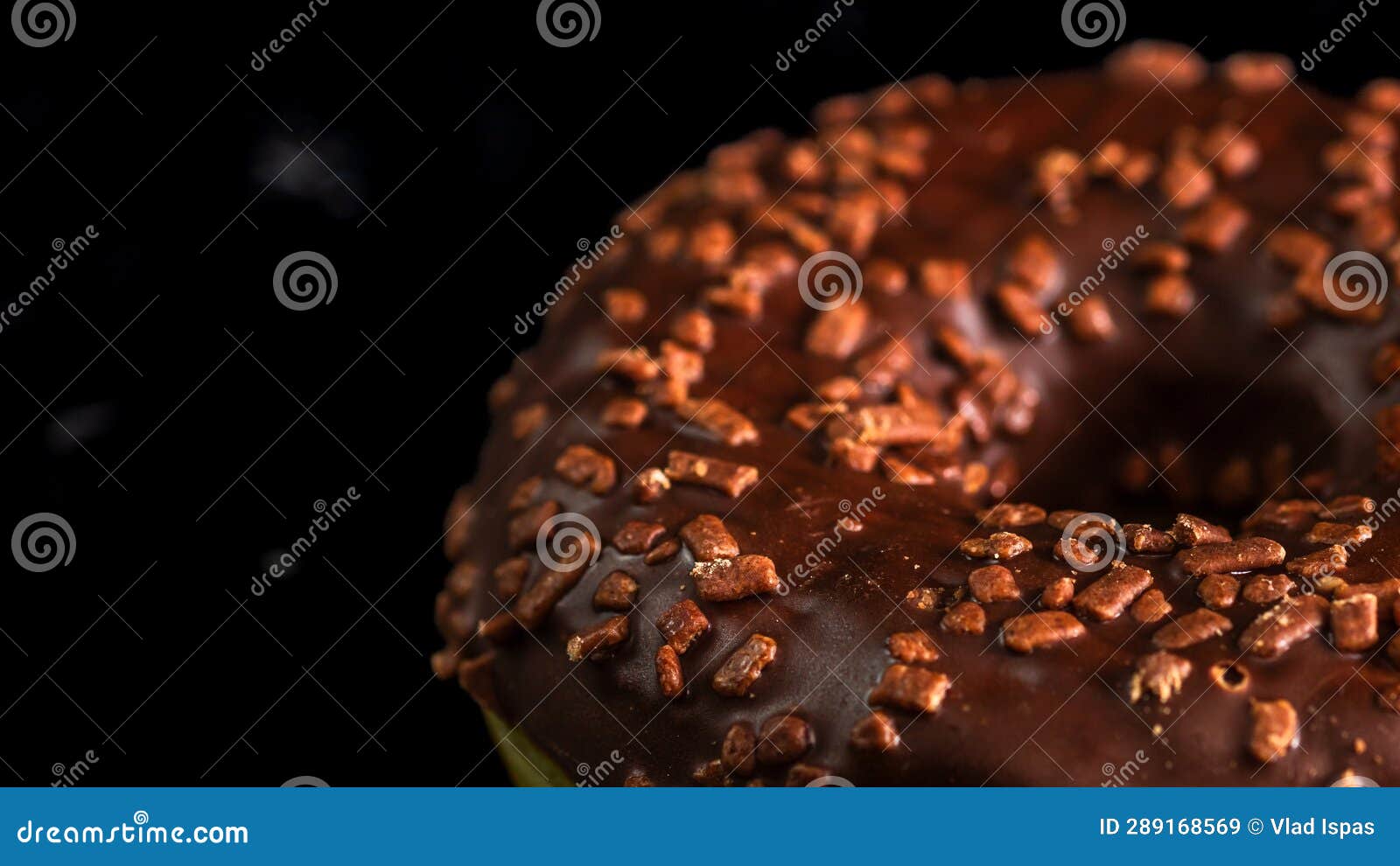 Chocolate Glazed Donut with Chocolate Chips Isolated. Close Up of