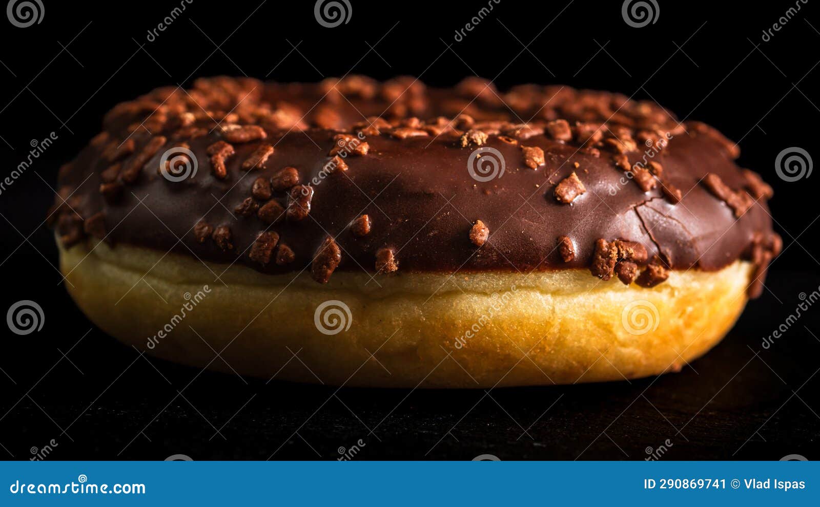Chocolate Glazed Donut with Chocolate Chips Isolated. Close Up of