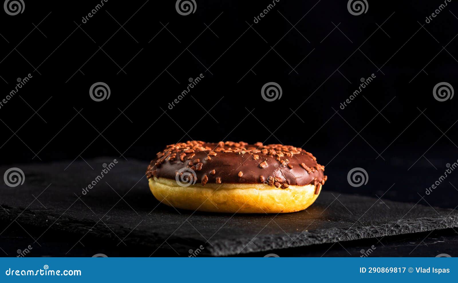 Chocolate Glazed Donut with Chocolate Chips Isolated. Close Up of