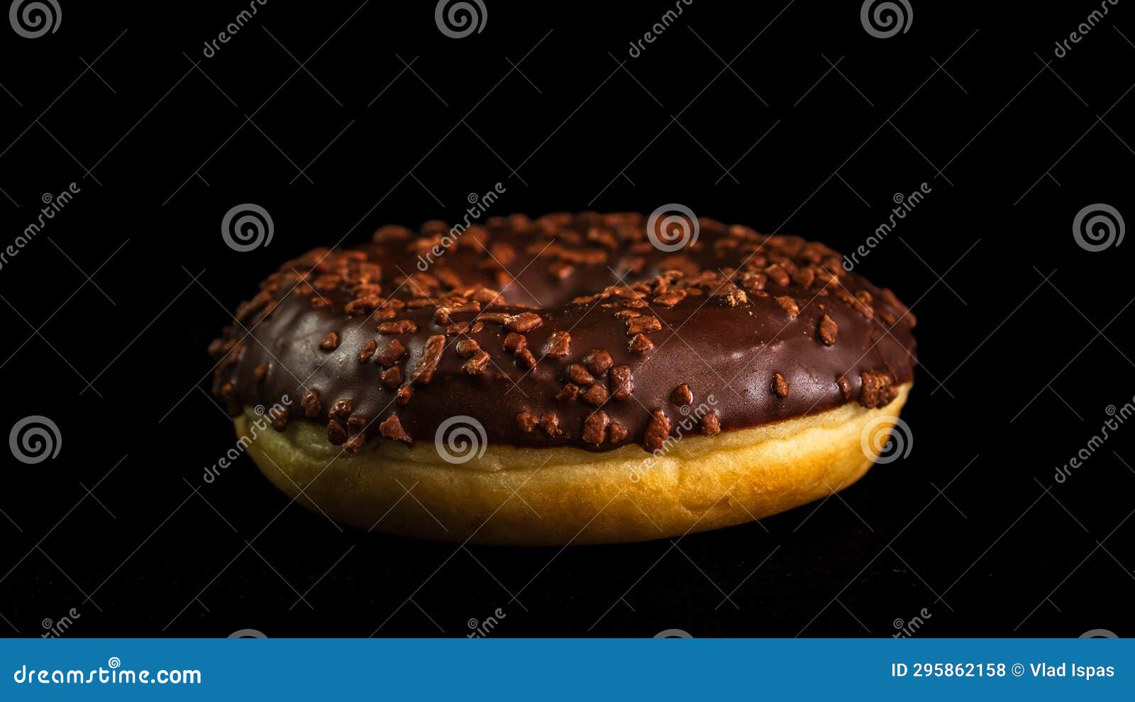 Chocolate Glazed Donut with Chocolate Chips Isolated. Close Up of