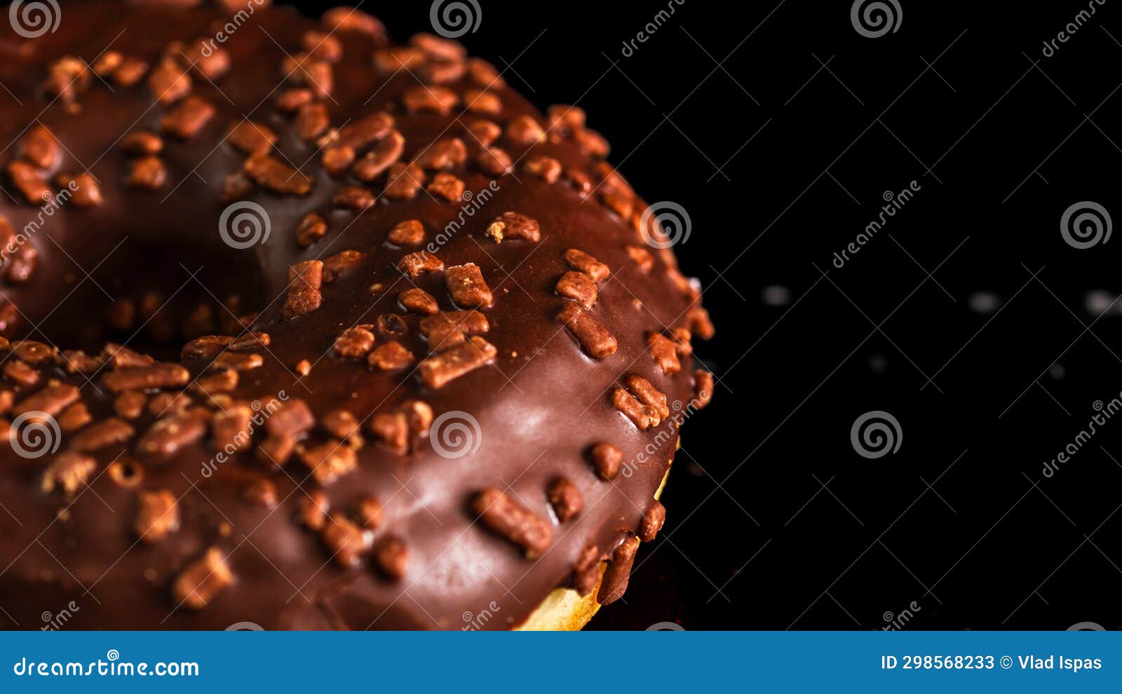 Chocolate Glazed Donut with Chocolate Chips Isolated. Close Up of