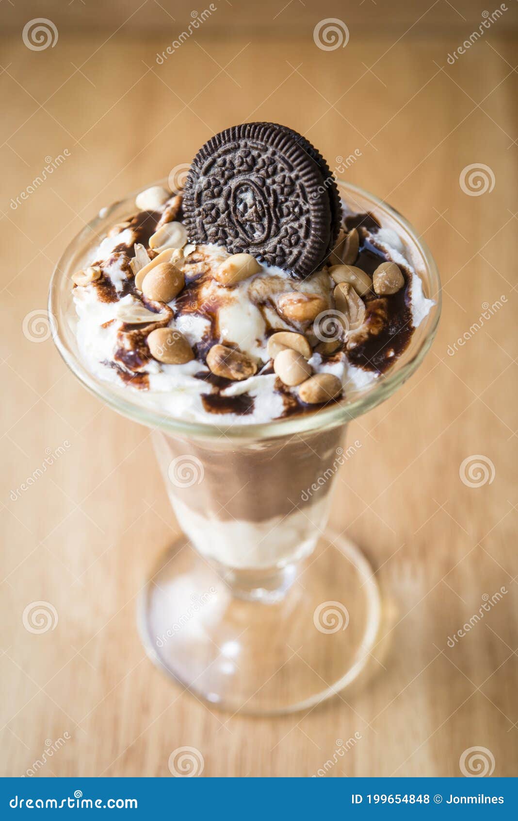 chocolate ice-cream sundae with biscuit on top for decor