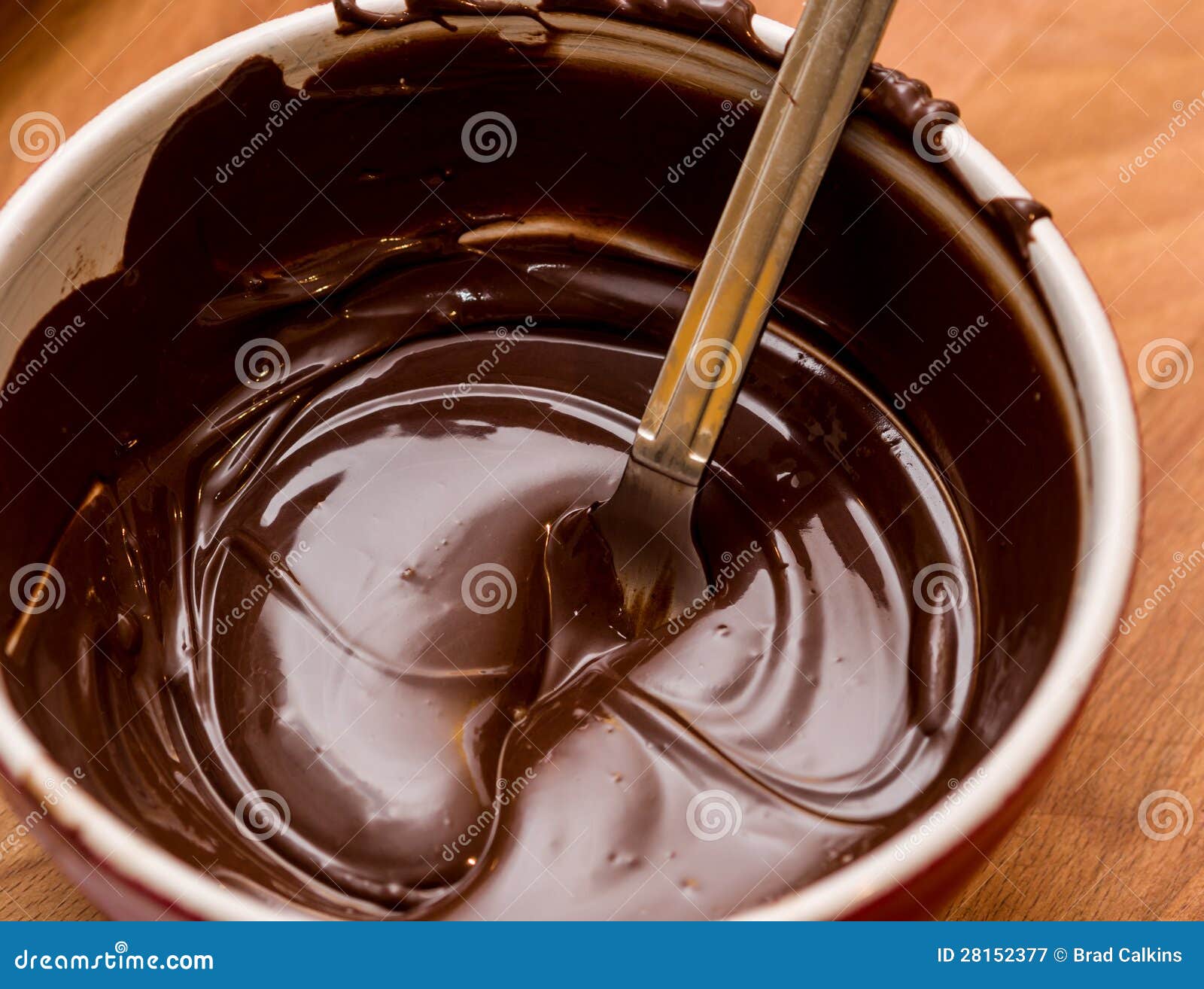Chocolate melting in bowl stock image. Image of baking 28152377