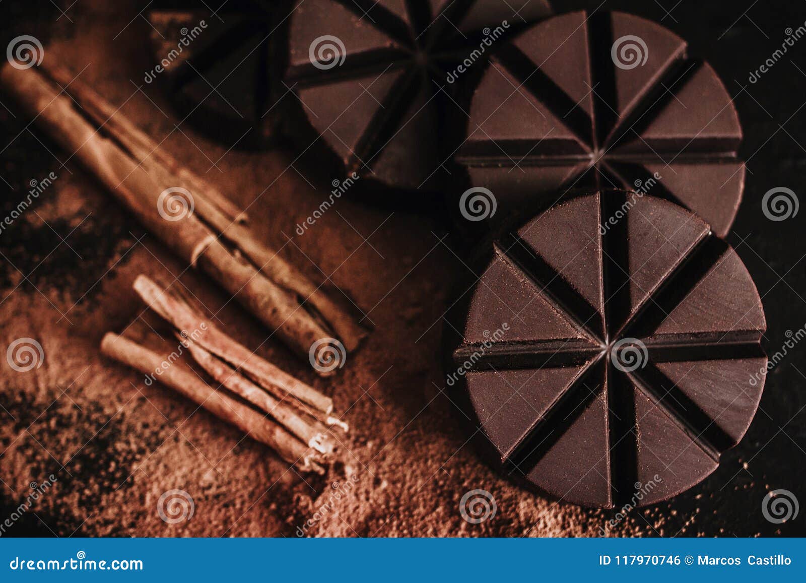 chocolate mexicano, cinnamon sticks and mexican chocolate from oaxaca mexico on wooden in rustic style