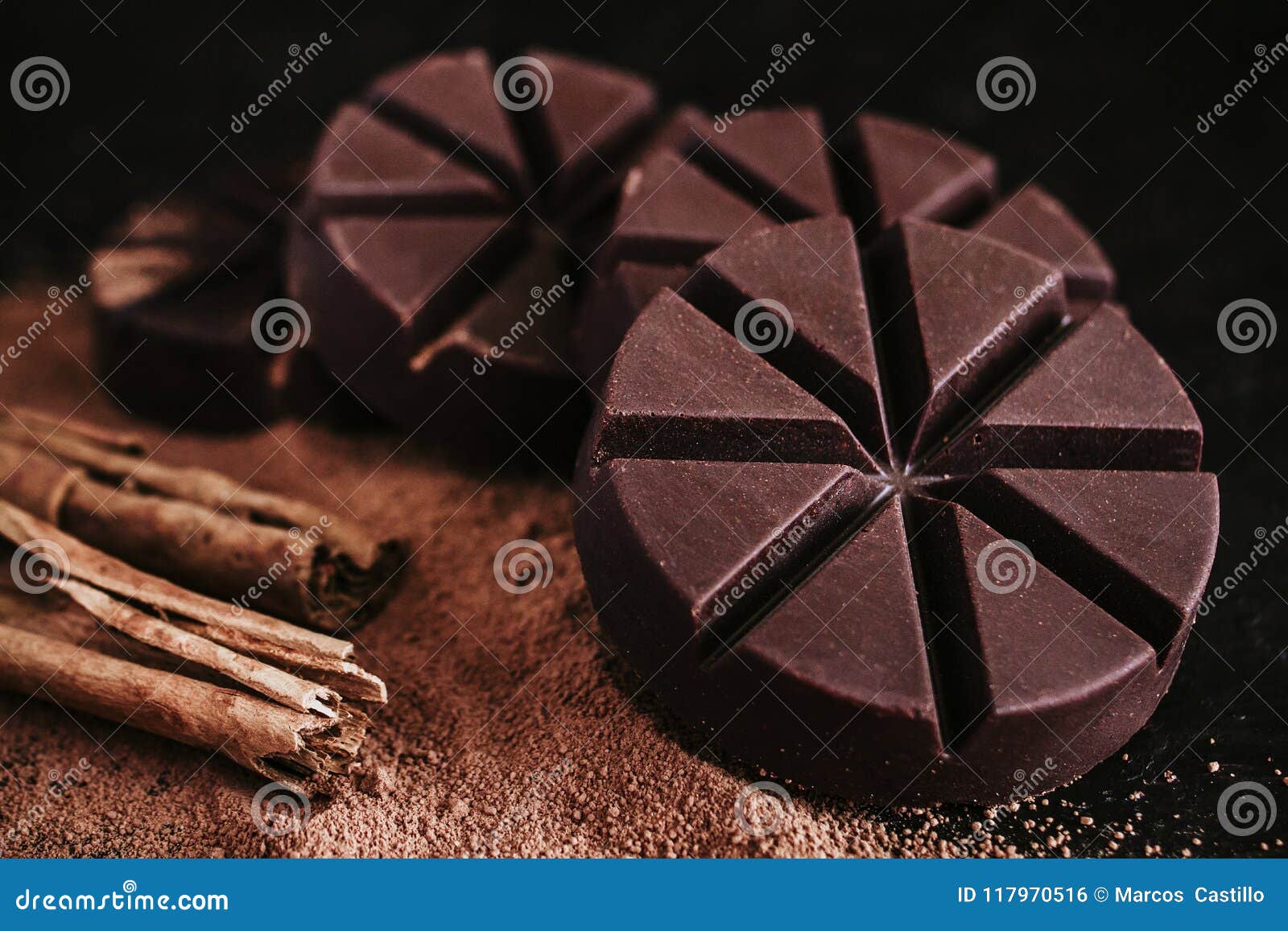 chocolate mexicano, cinnamon sticks and mexican chocolate from oaxaca mexico on wooden in rustic style