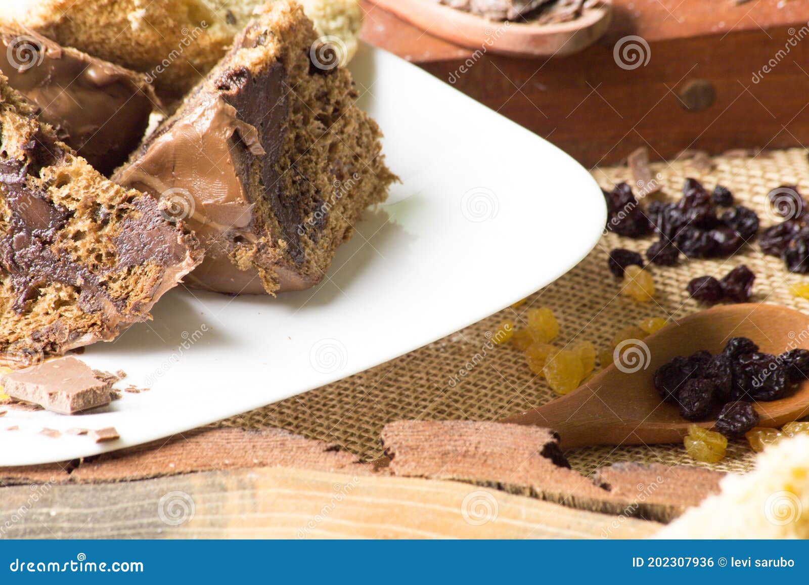 Chocolate on White Plate. Rustic Table with Ingredients Stock