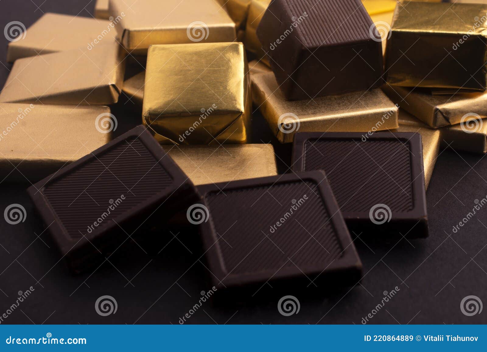 Chocolates in gold foil stock image. Image of foil, wrapper 220864889