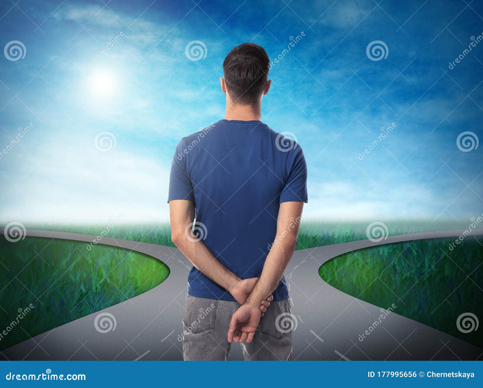 Choose your way. Man standing at crossroads taking important decision