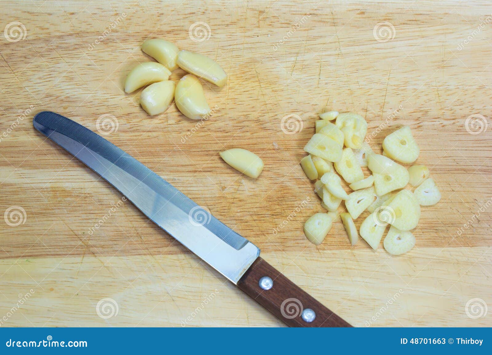 Chopped Garlic with a Knife on the Cutting Board Stock Image Image of