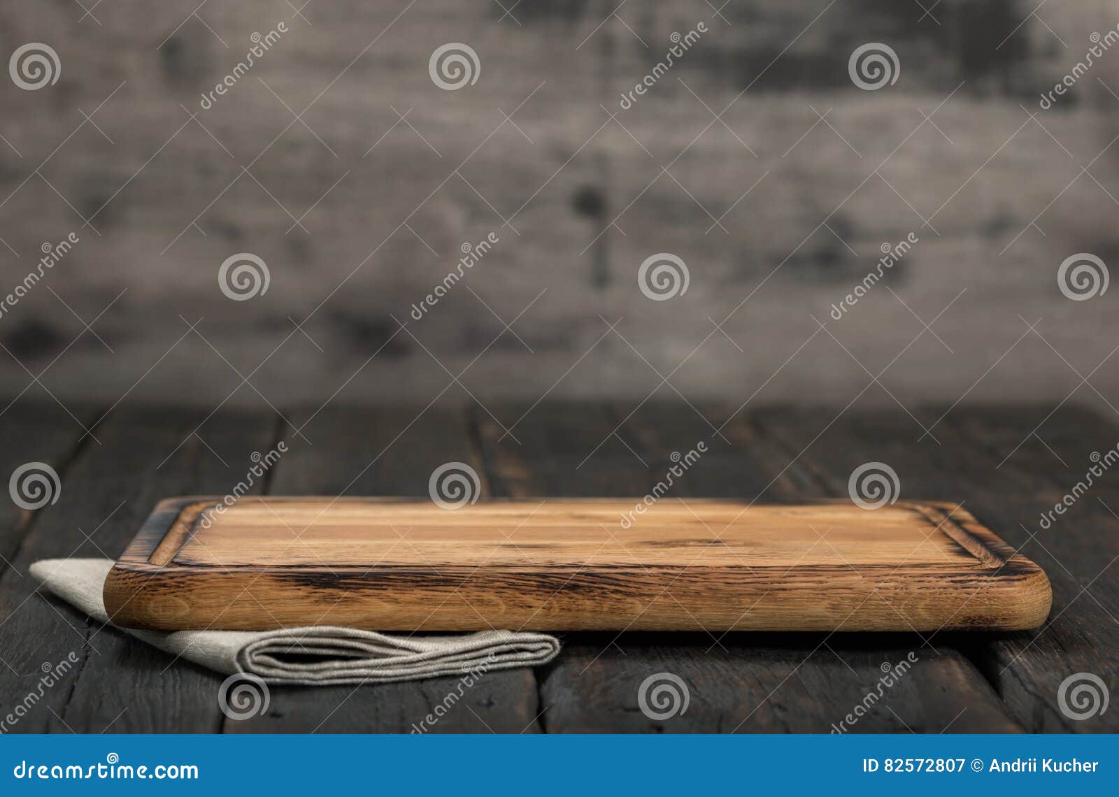 chopping board on dark wooden background close up