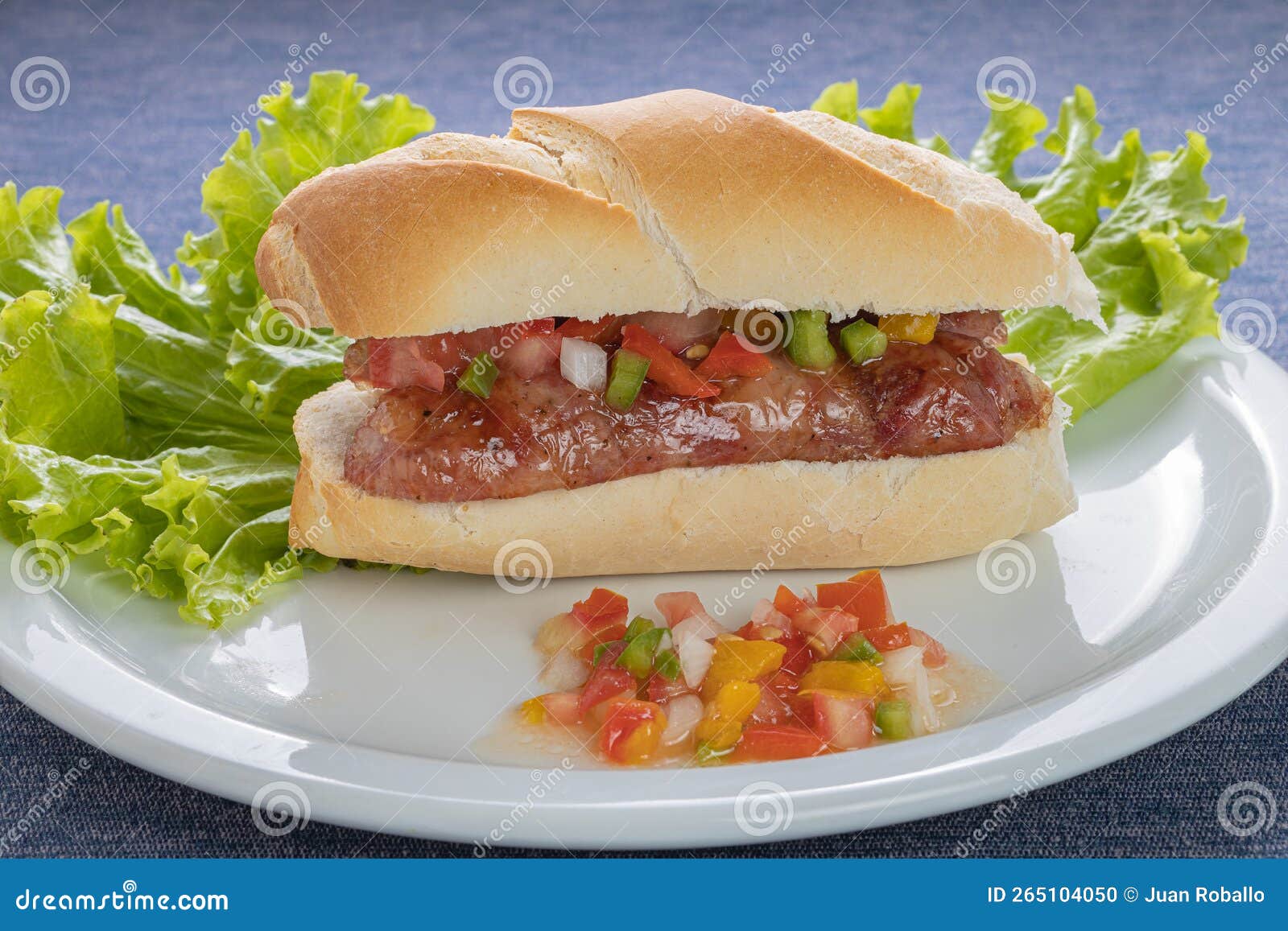 Choripan, Typical Argentine Sandwich with Chorizo and Creole Sauce on a ...
