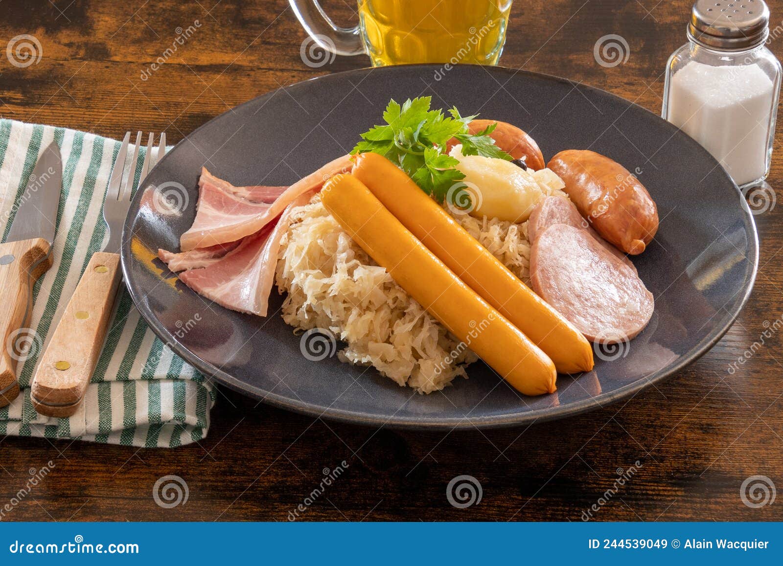choucroute garnie french for dressed sauerkraut is an alsatian recipe for preparing sauerkraut with sausages and other
