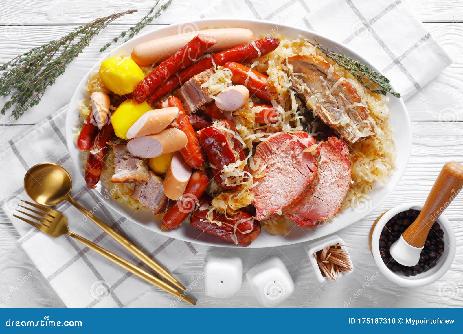 choucroute garnie sour cabbage stew on a plate