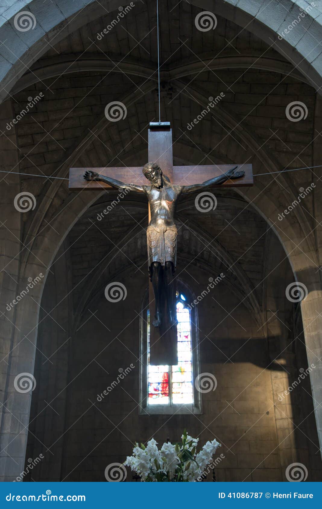 Christ from the 13th century in the St Flour cathedral (France). Hi Res. The Beau Dieu noir (the beautilful black Christ) in the Saint Flour cathedral was made in the 13th century. France