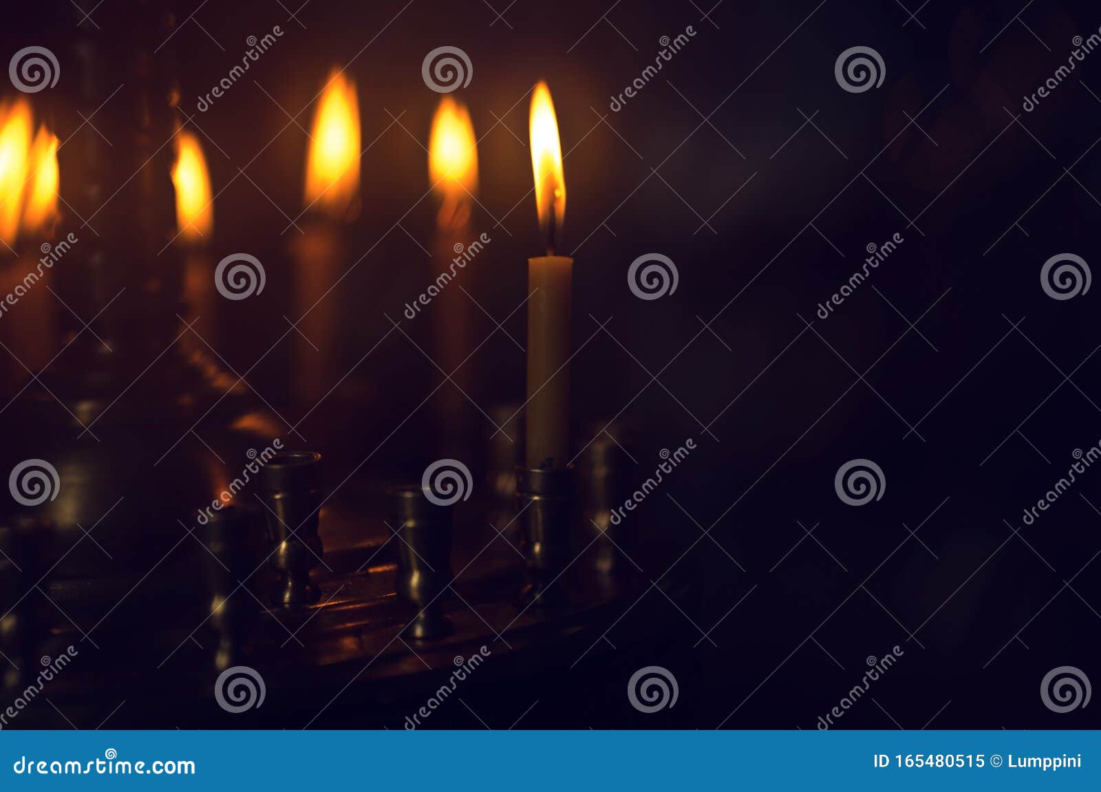 christening in the church. catholicism and orthodoxy. candle on a blurred background