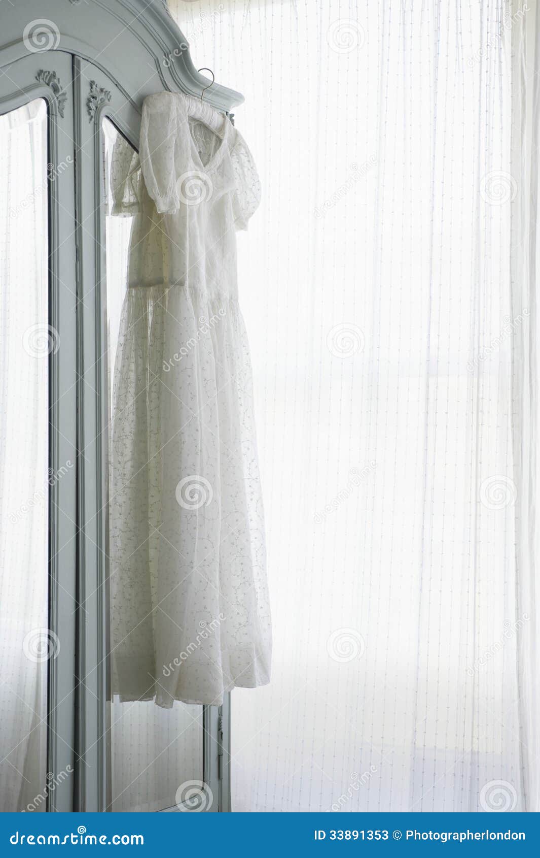 Christening Gown on Wardrobe Stock Image - Image of gown, mirror: 33891353