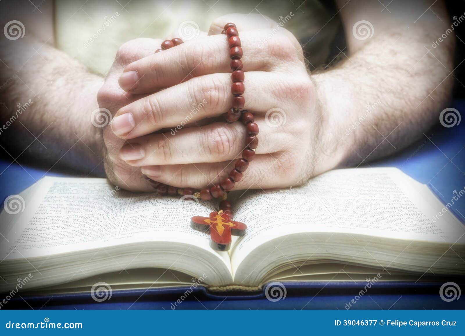 christian believer praying to god with rosary