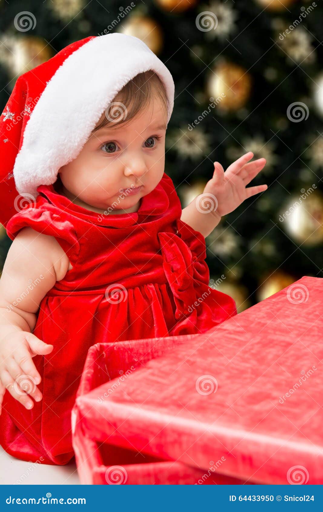 Christmas Baby Girl and Present Stock Photo - Image of knitted ...