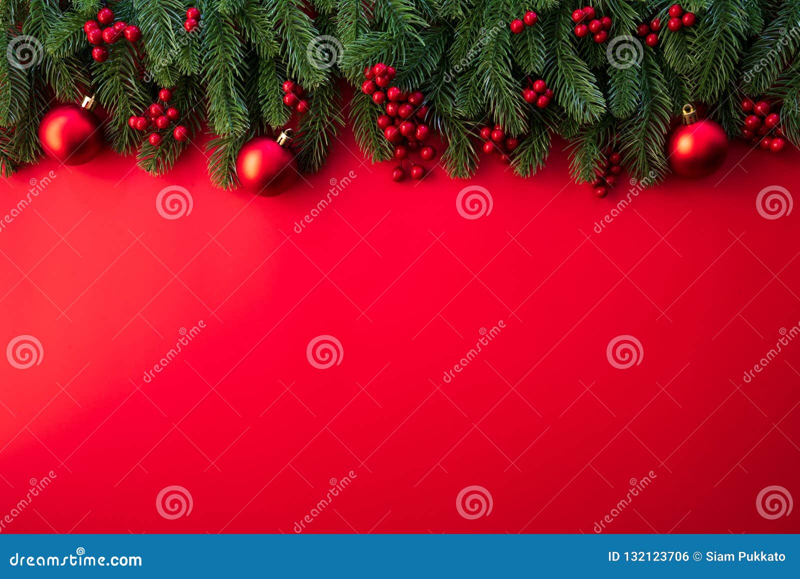 christmas background concept. top view of christmas with spruce branches, pine cones, red berries