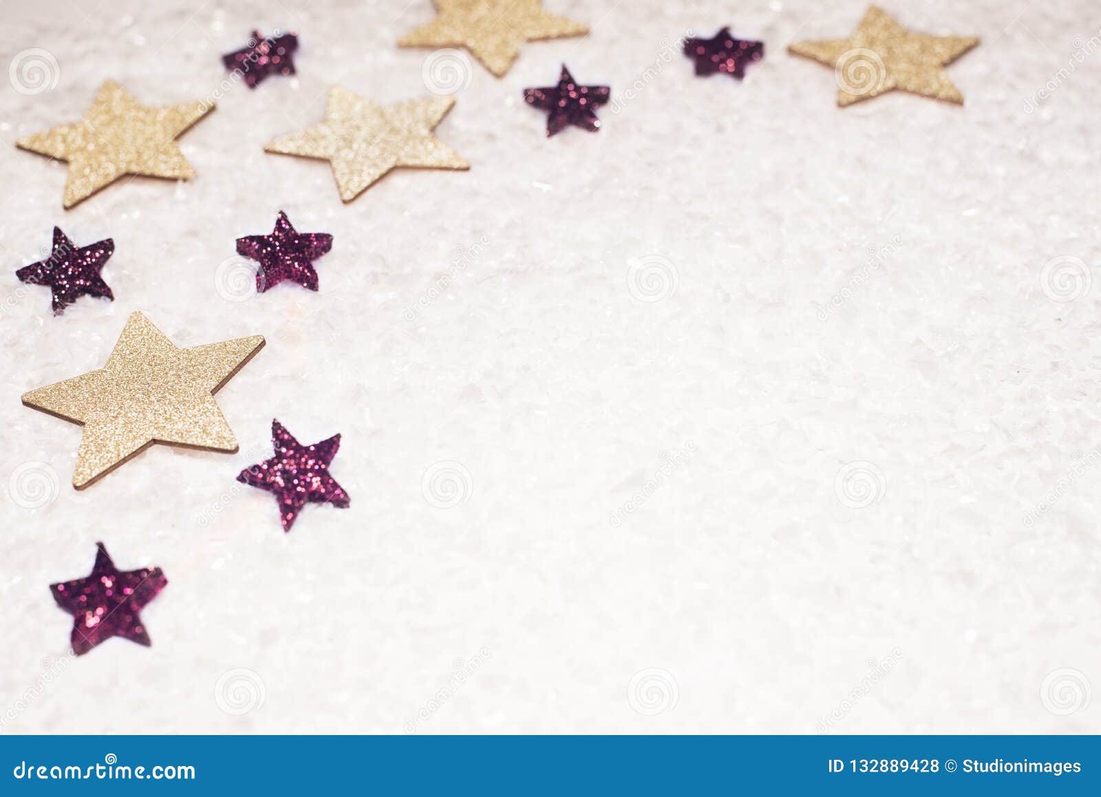 christmas background, with golds and purple glitter stars and sn