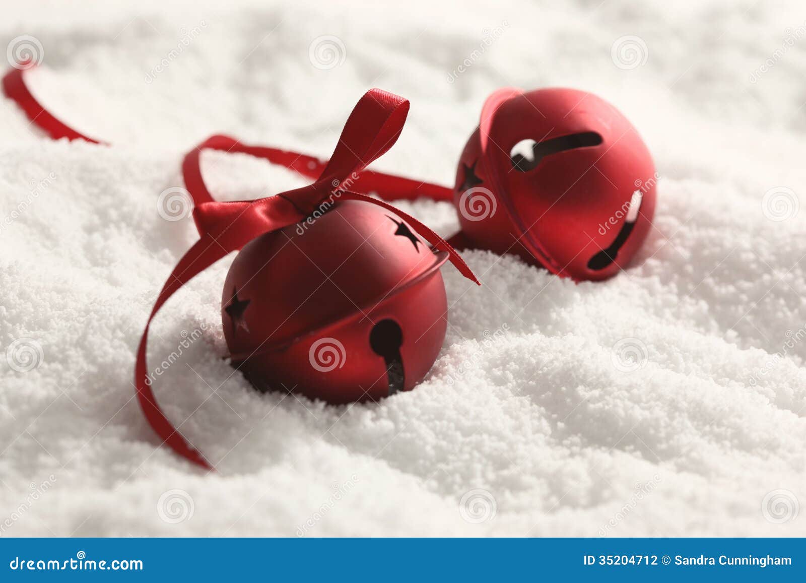 Christmas Bells With Ribbon In Snow Stock Photography 