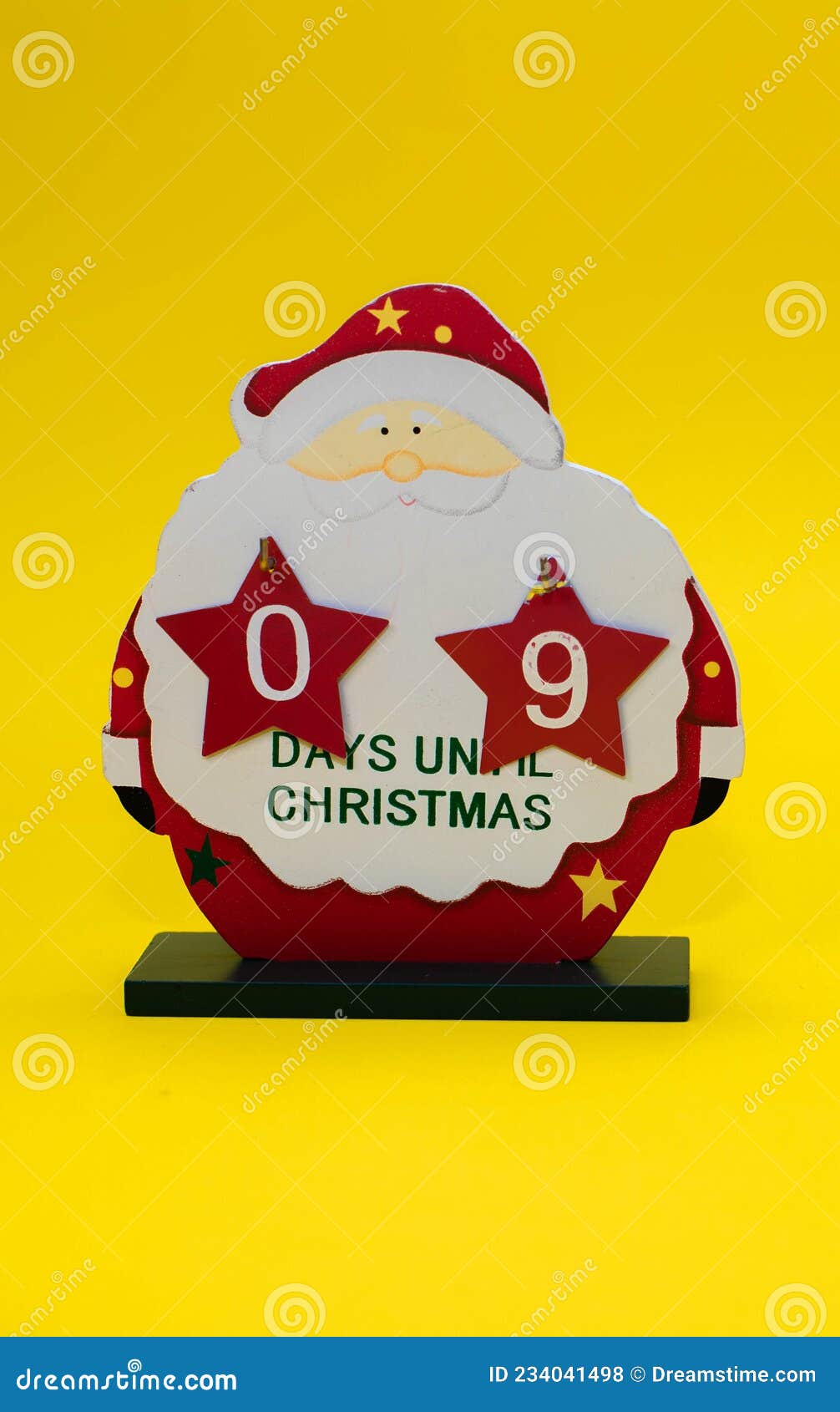 Christmas Calendar Counting Down the Days of a Wooden Santa Claus Stock