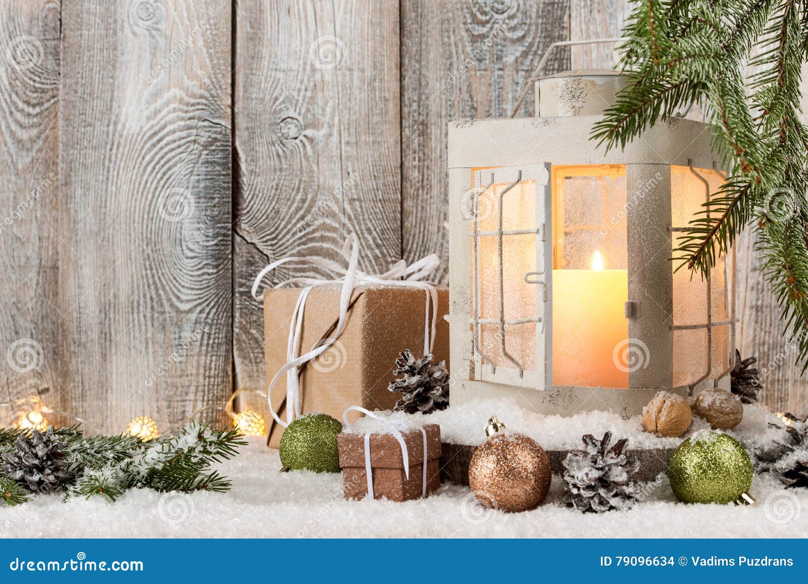 Christmas Candle Lantern, Gift Boxes and Decoration on Snow Stock Photo