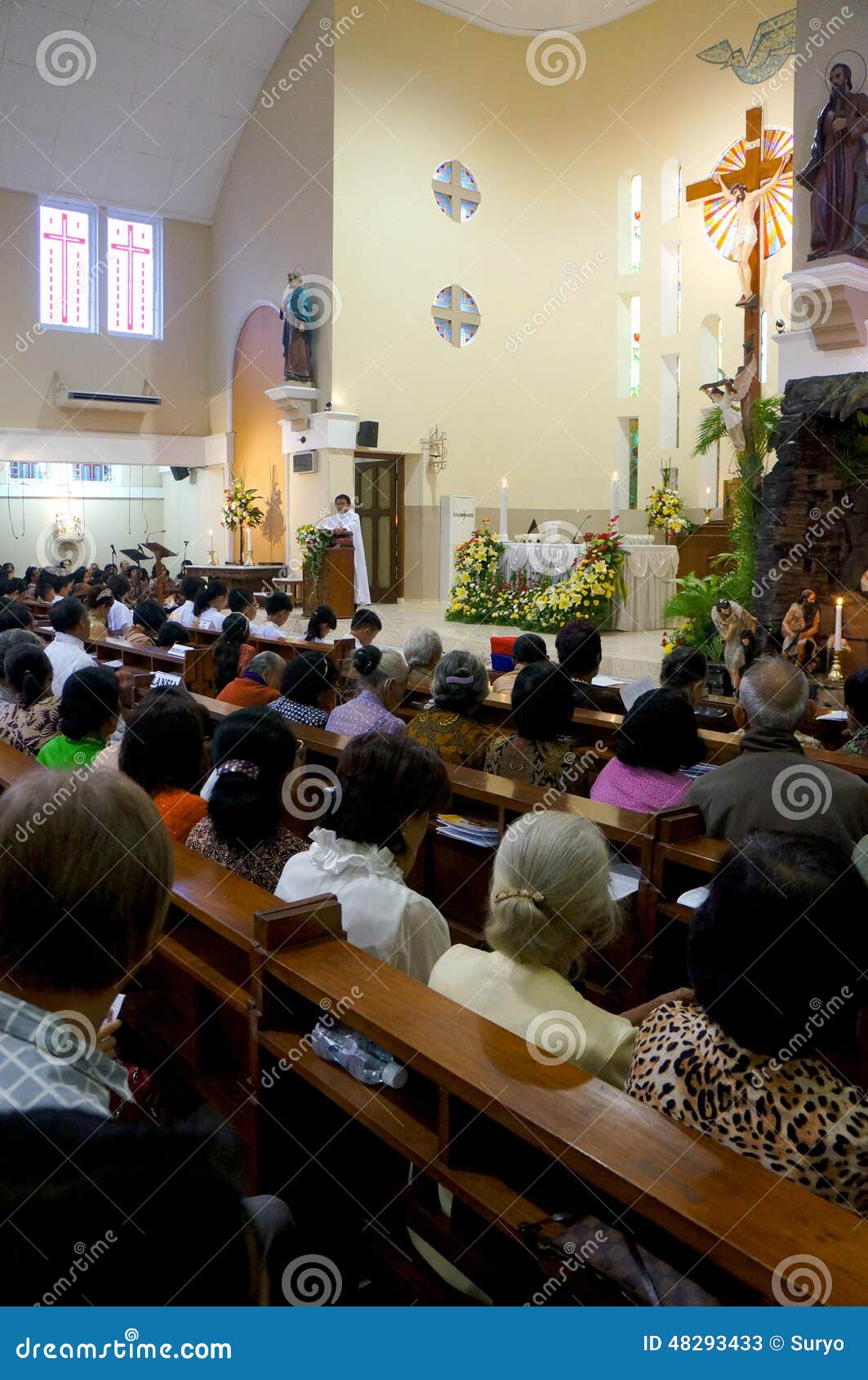 Catholics pray in the church during the celebration of Christmas in the city of Solo, Central Java, Indonesia