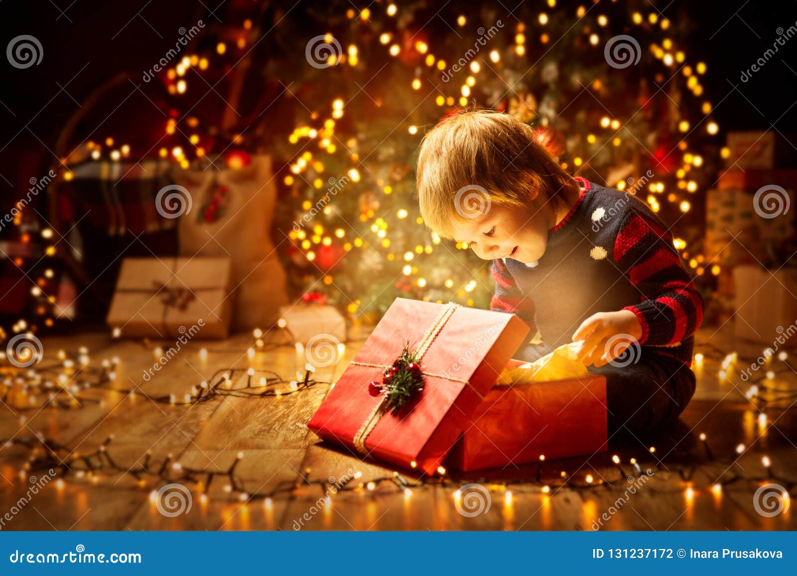 christmas child open present gift, happy baby boy looking box