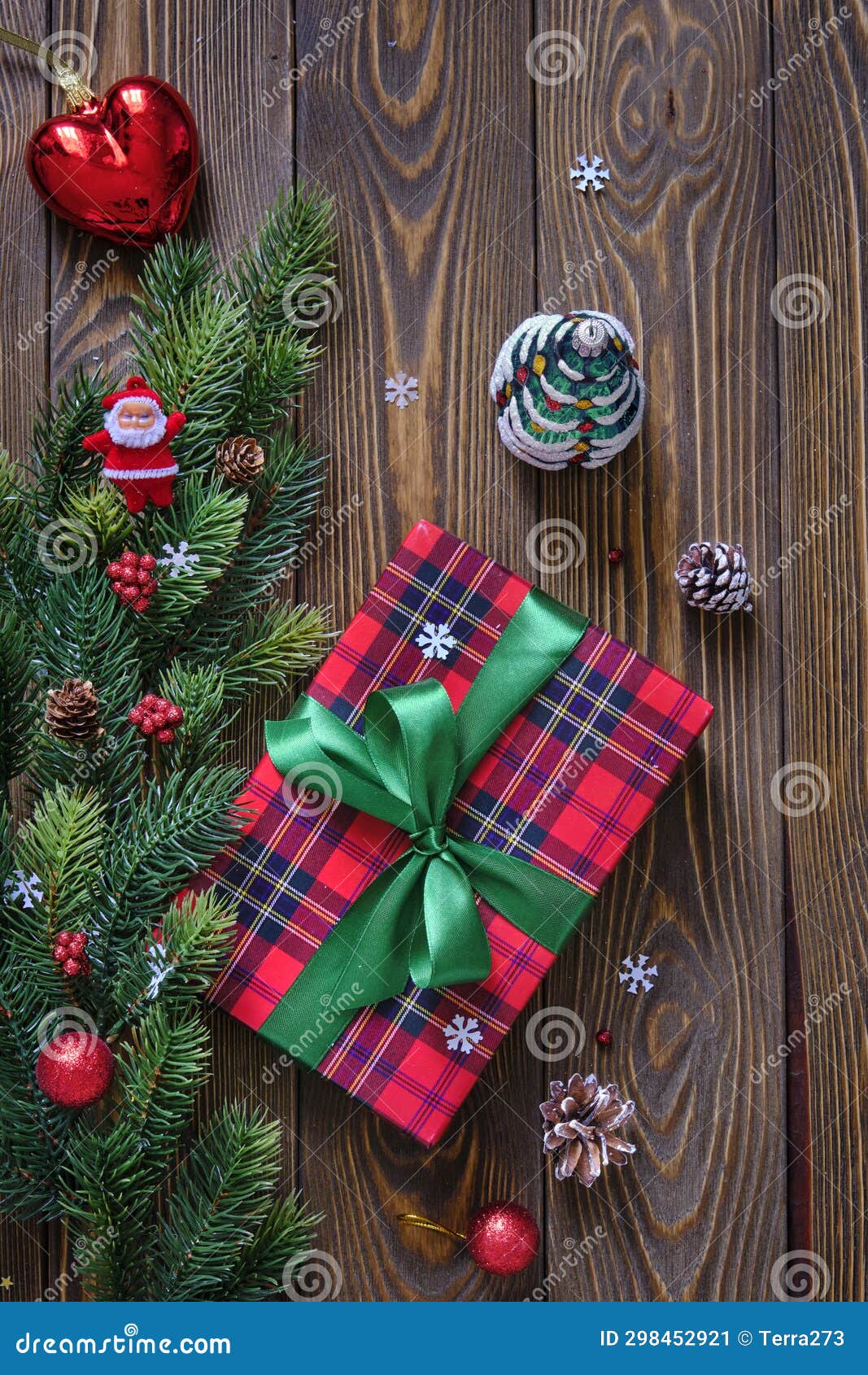 Christmas Composition. Christmas Tree Branches and Red Gift Box on the
