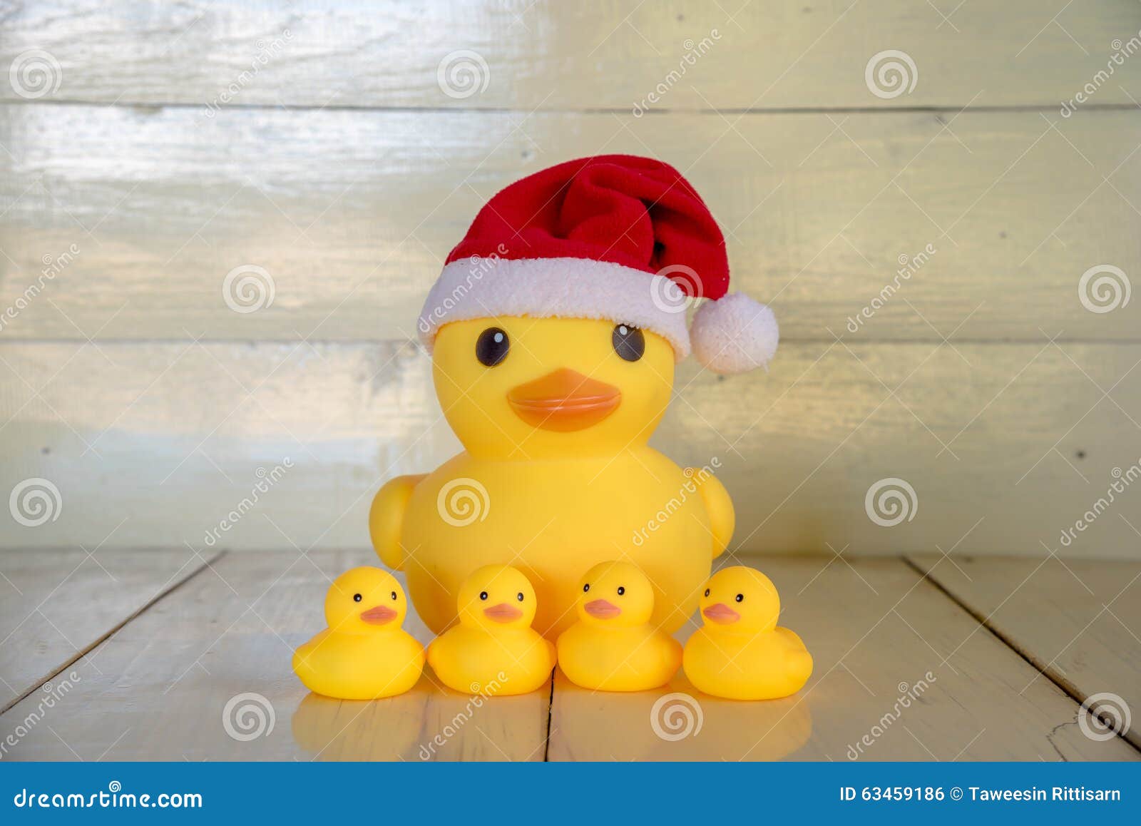 https://thumbs.dreamstime.com/z/christmas-concept-rubber-yellow-duck-wear-santa-clause-hat-gift-boxes-set-as-decoration-white-color-wood-board-63459186.jpg