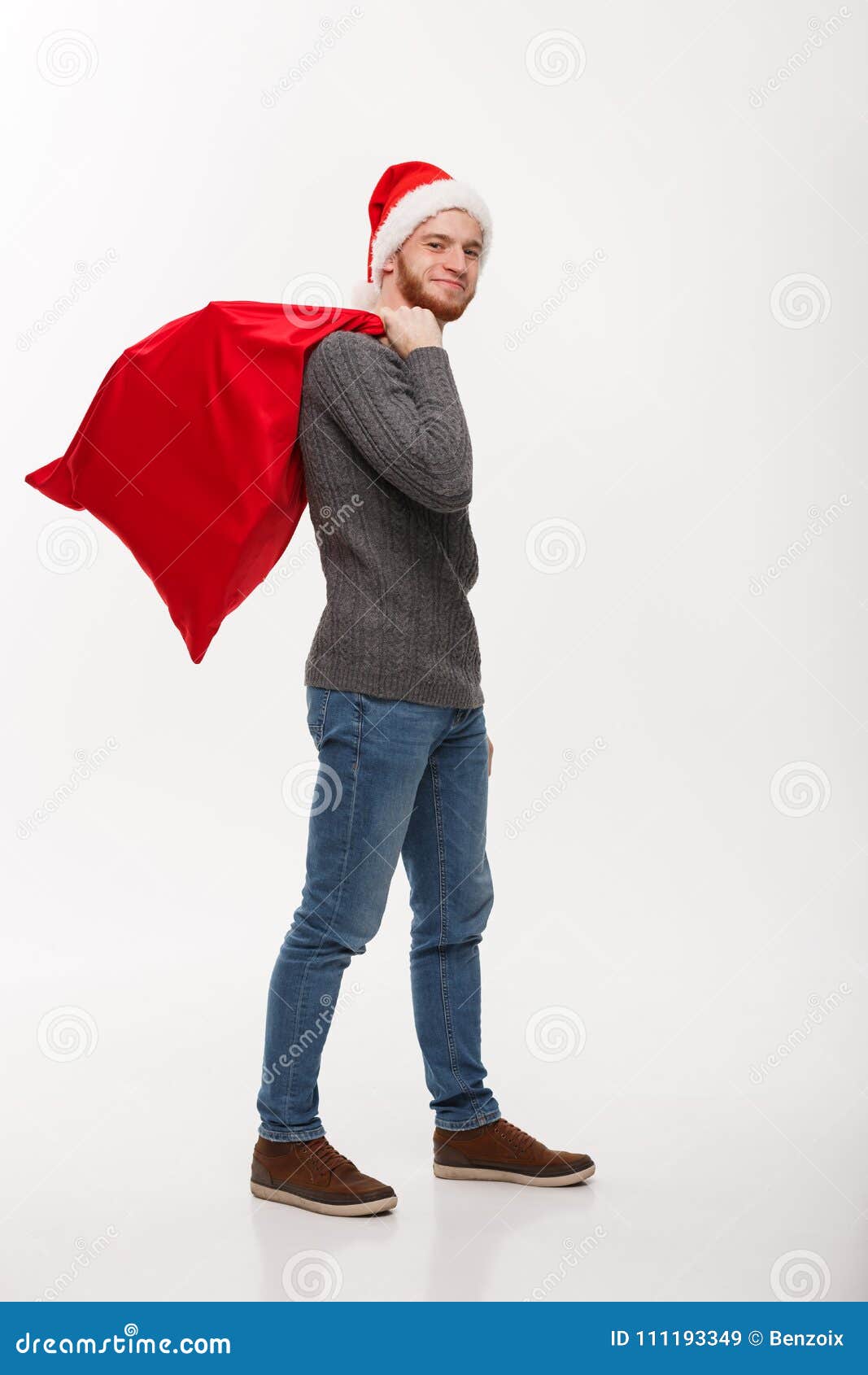 Christmas Concept - Young Confident Smart Man Holding Red Big Santa Bag ...