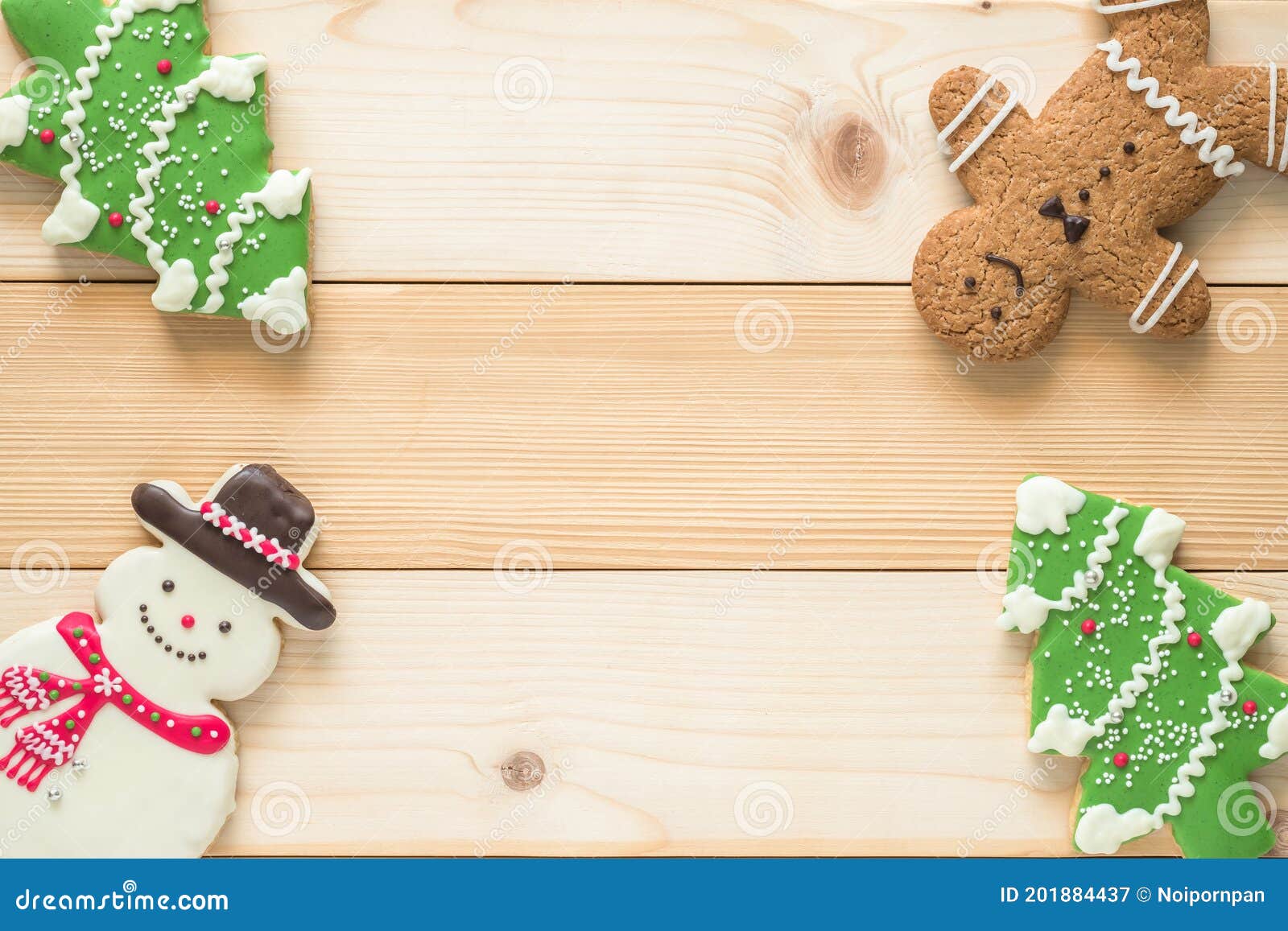 christmas cookies, snowman, xÃ¢â¬â¢mas tree, gingerbread flat lay on wooden cutting board background top view for xmas party holiday