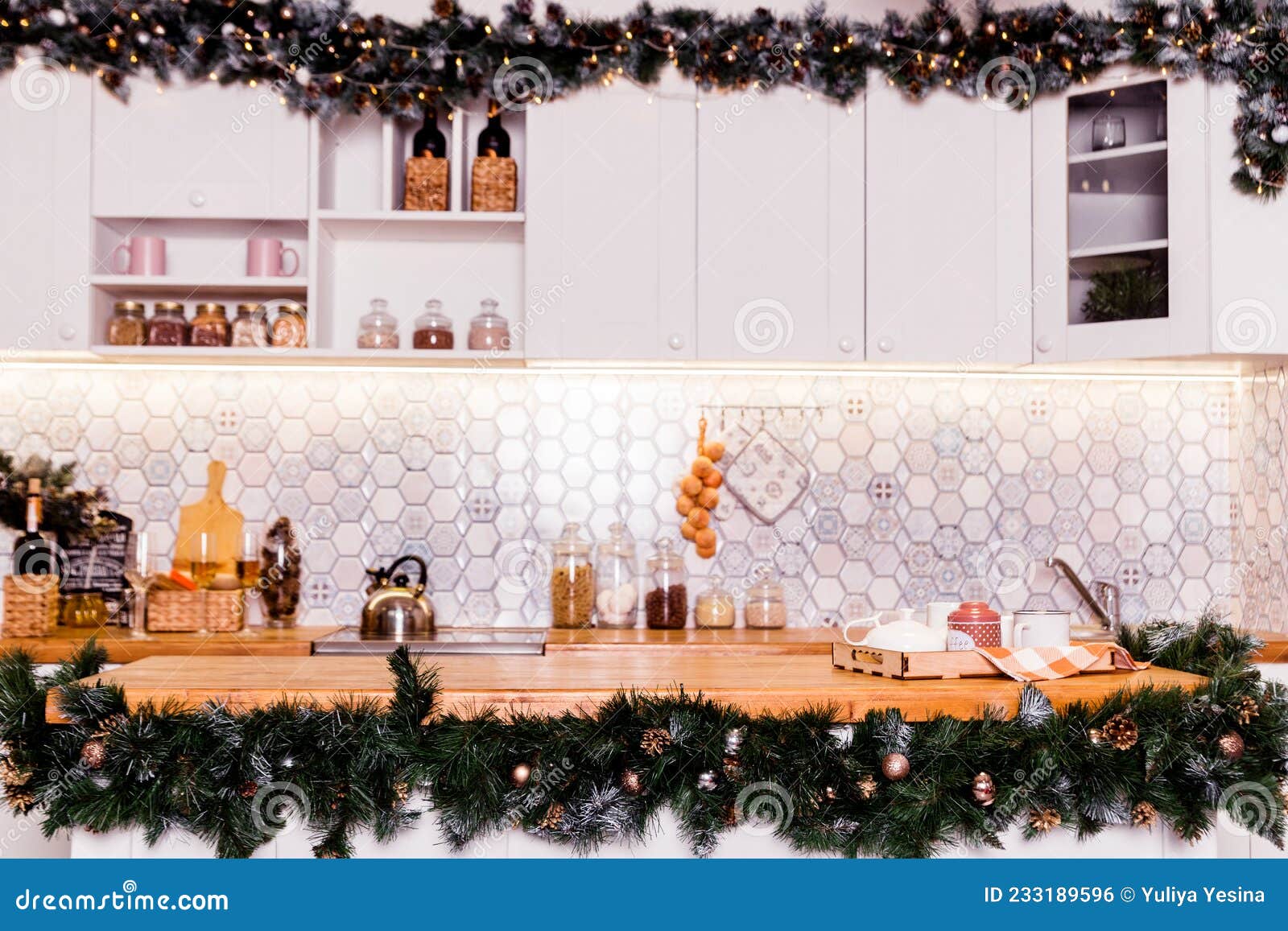 Christmas Decor with a Garland in the White Kitchen Stock Photo Image